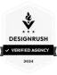 Hexagonal badge with a torch symbol at the top, followed by "DESIGNRUSH" and a checkmark with "VERIFIED AGENCY" underneath. The badge is labeled "2024" at the bottom. - Clio Websites | Top Canadian Web Design Company